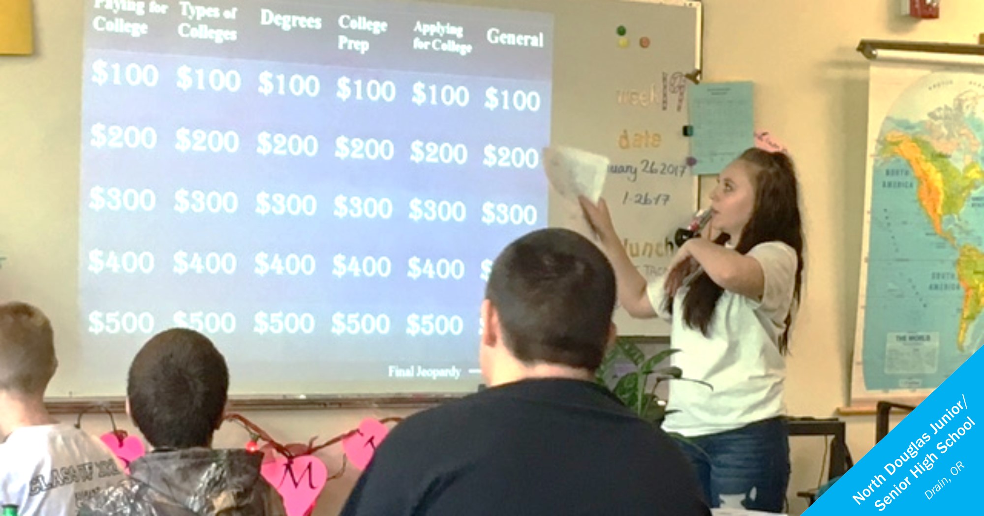 A speaker shows students a game of Jeopardy to teach about financial aid.