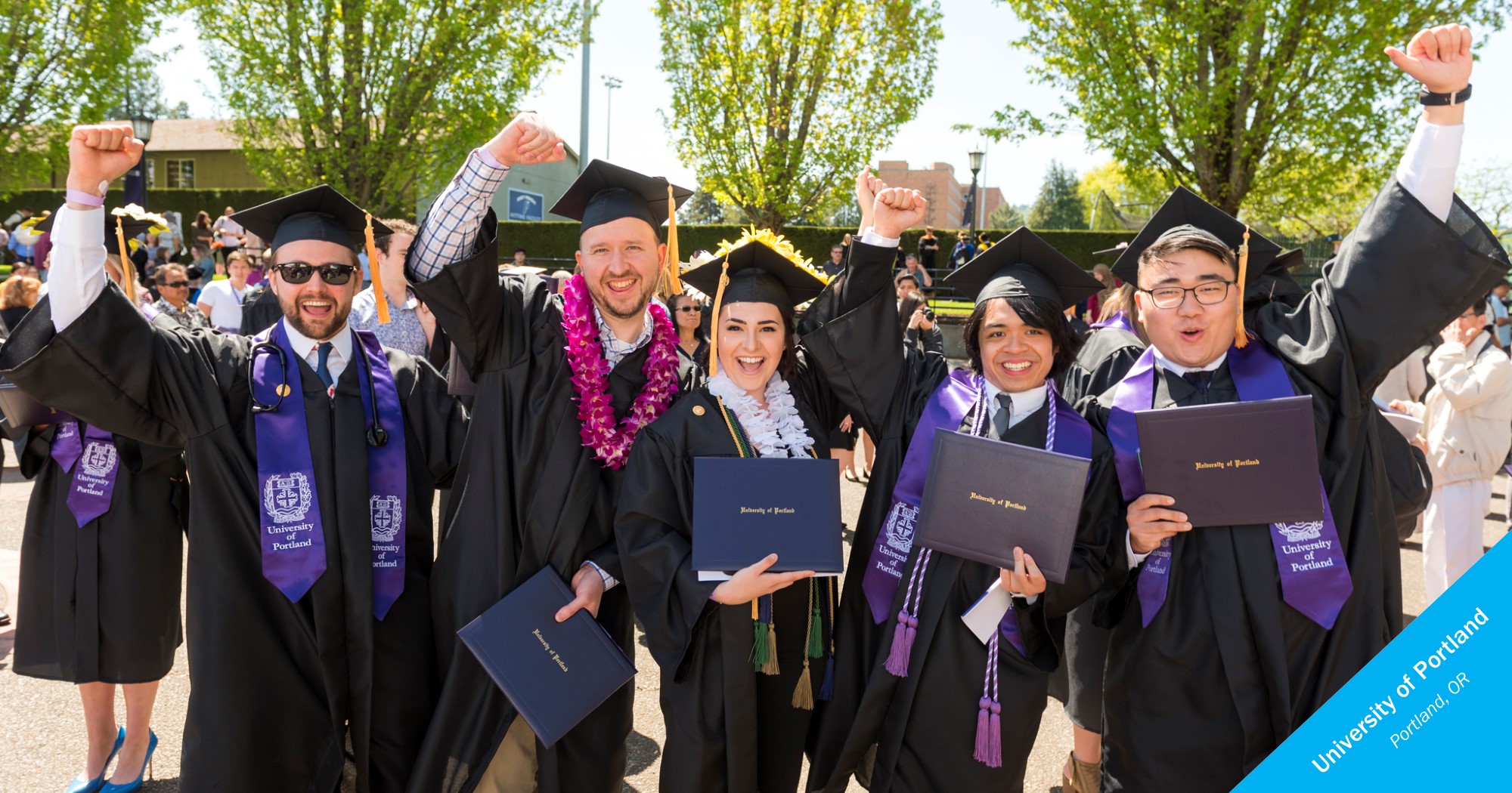 Smiling graduates of University of Portland