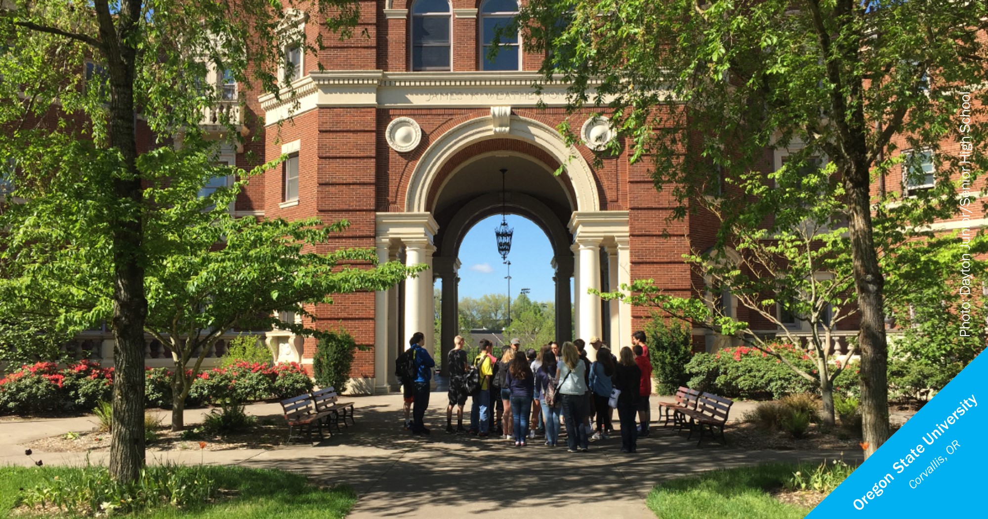 Students stand in front of an Oregon State University building