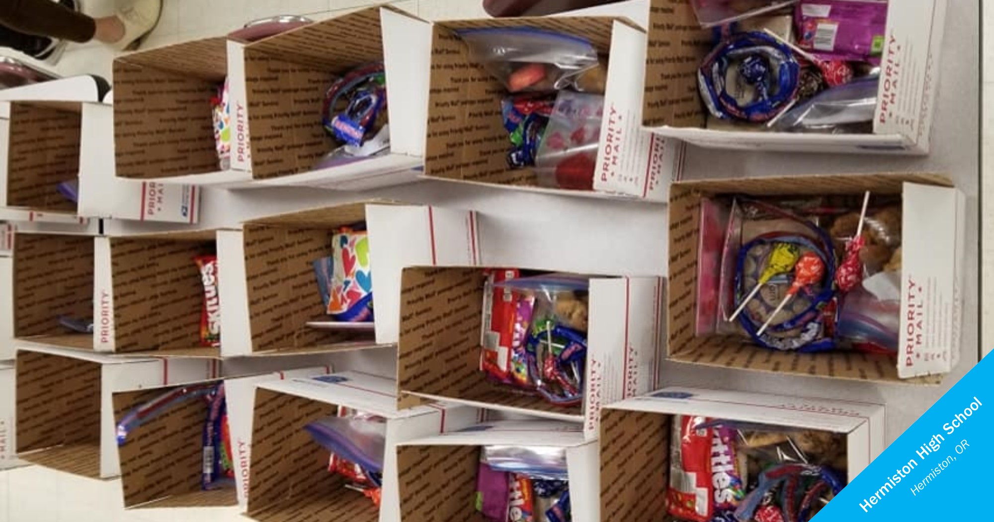 A row of boxes with candy and other treats