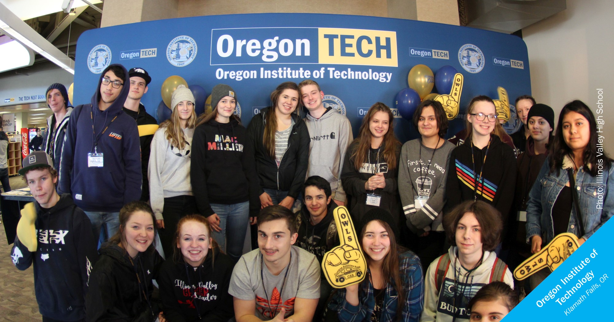 Smiling students from Illinois Valley High school in front of an OIT sign