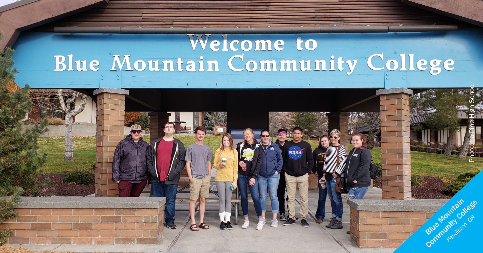 Smiling La Pine students in front of Blue Mountain Community College