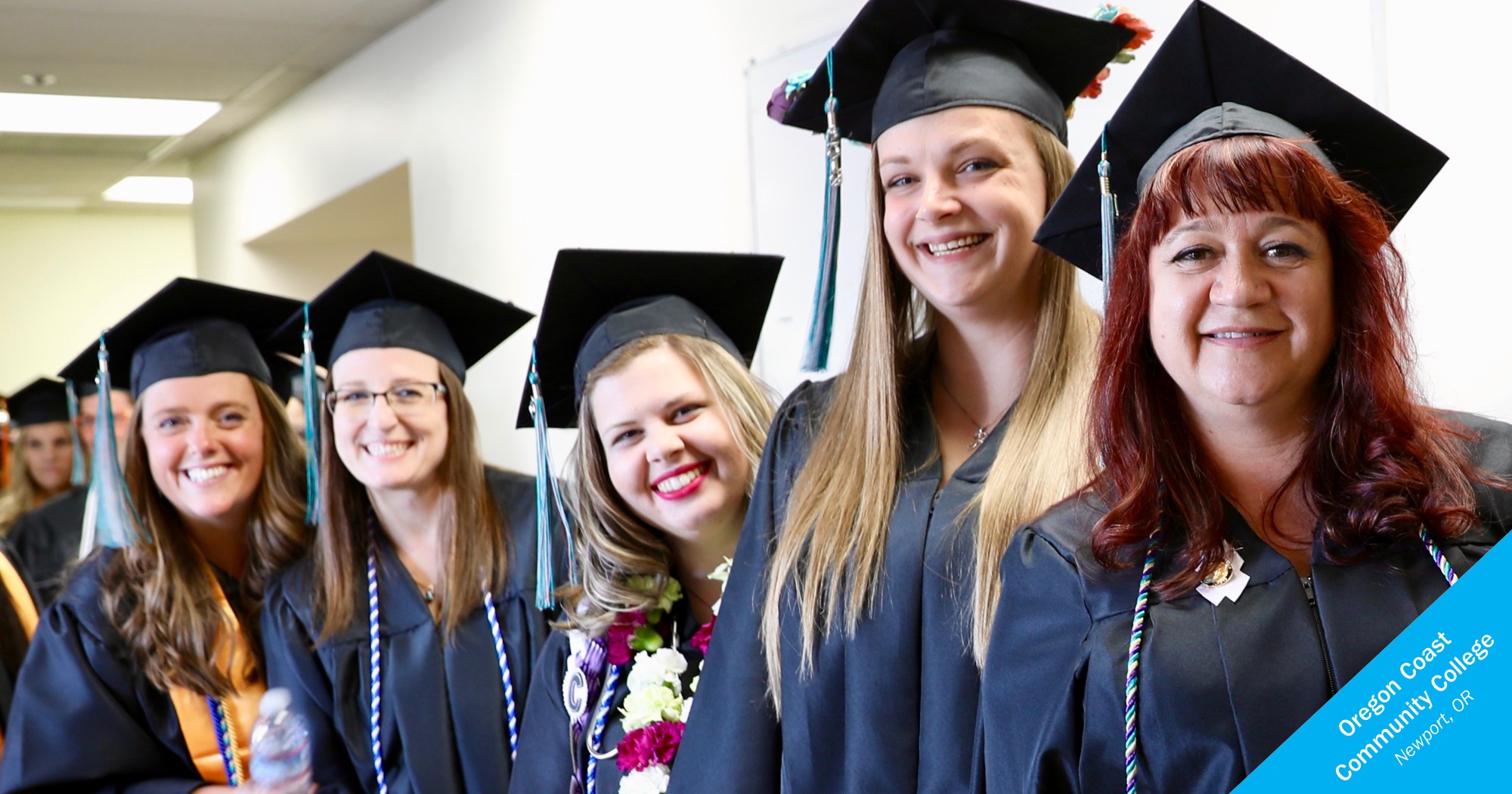 Smiling female graduates of Oregon Coast Community College