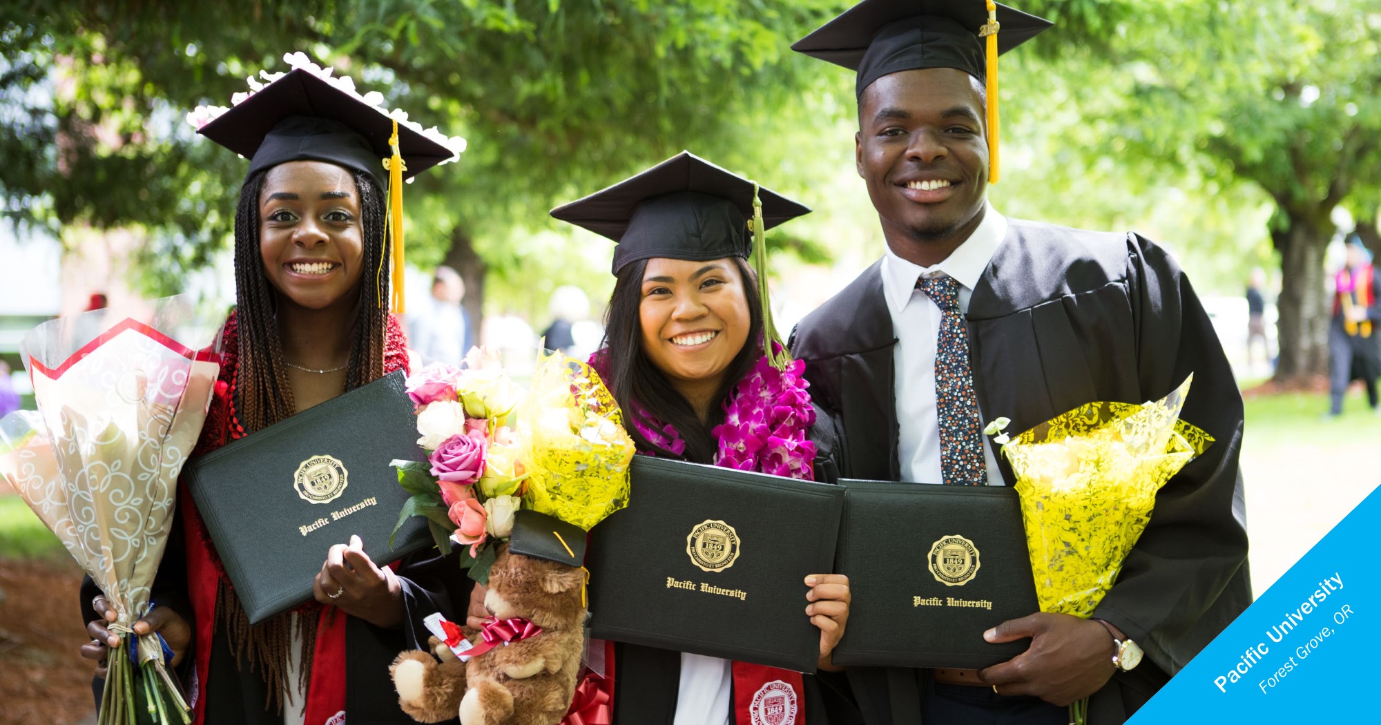Smiling graduates of Pacific University