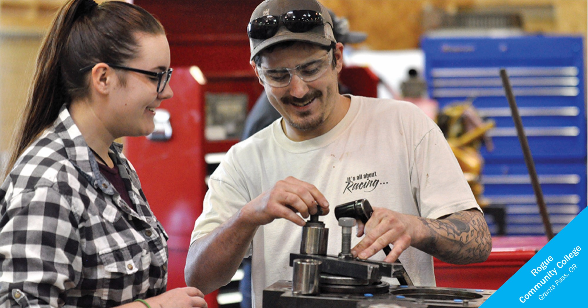 Female and male student working on a machine at Rogue Community College