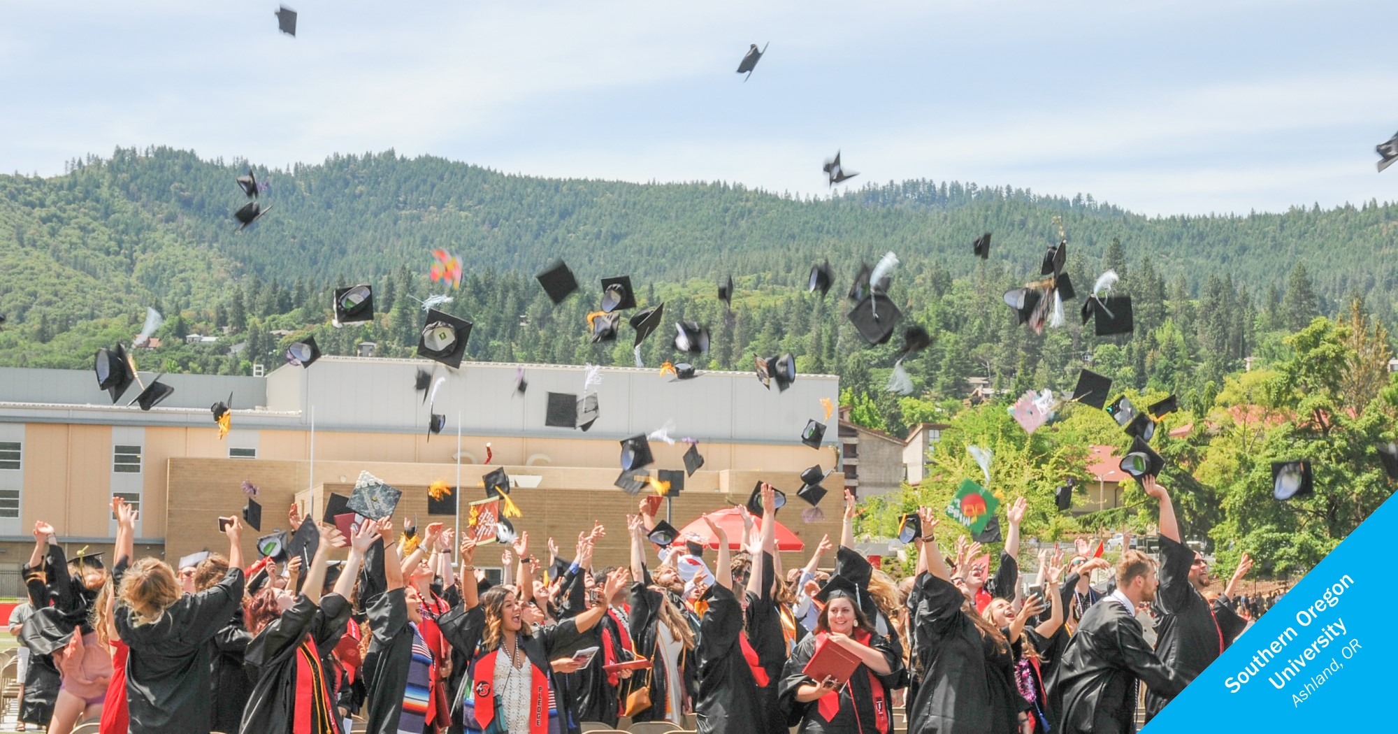 Graduates throwing caps at Southern Oregon University