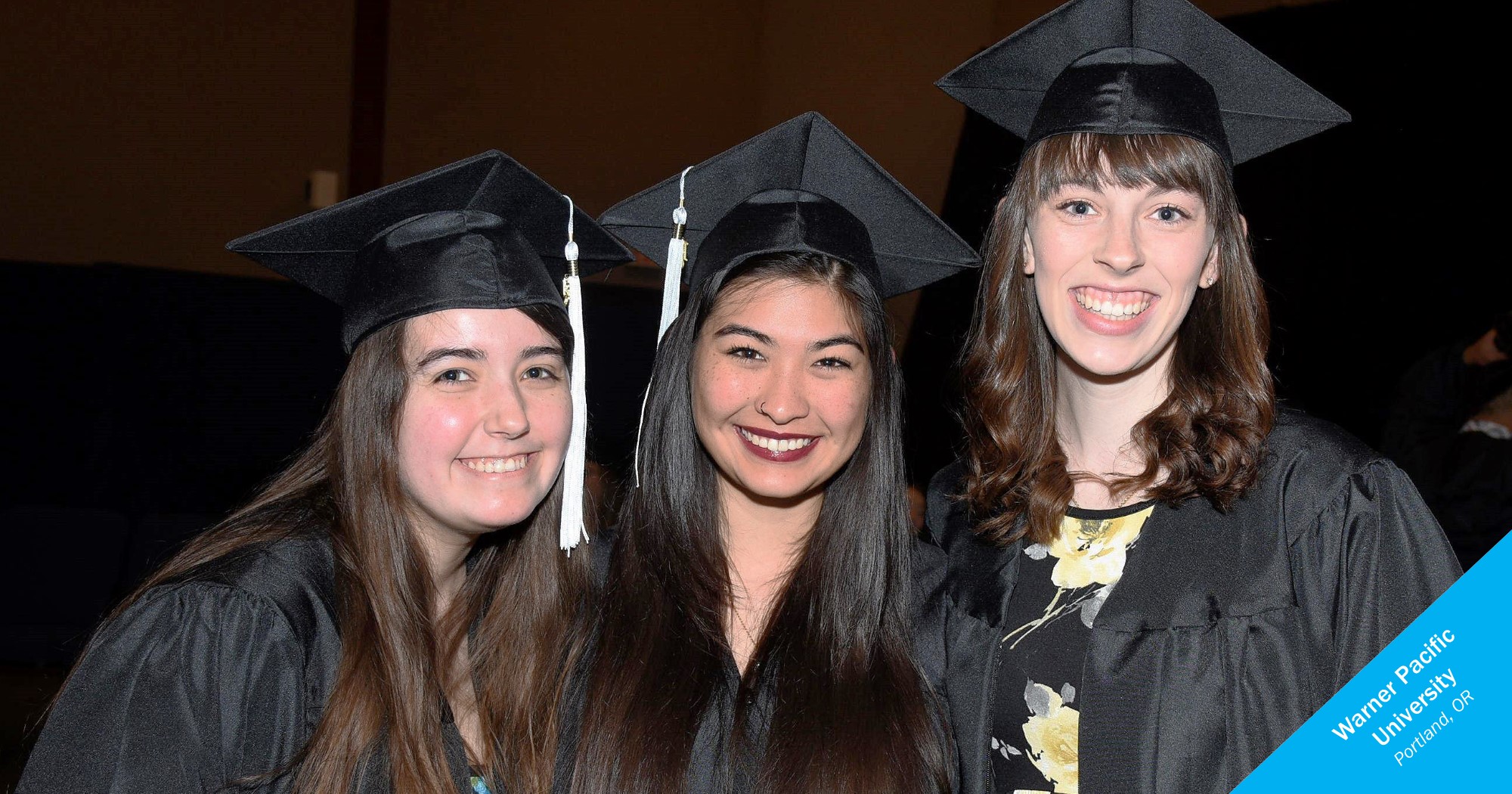 Smiling female graduates from Warner Pacific University